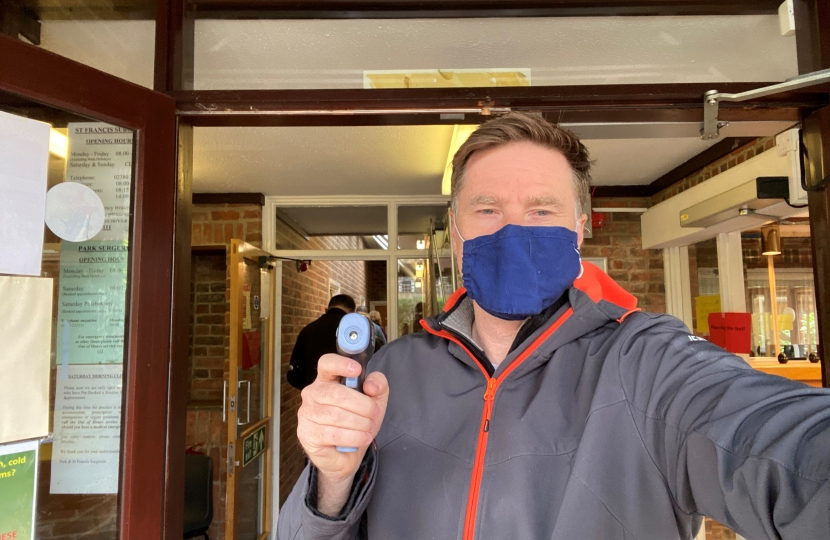 Pictured; Steve with the temperature gun at the entrance to Park Surgery