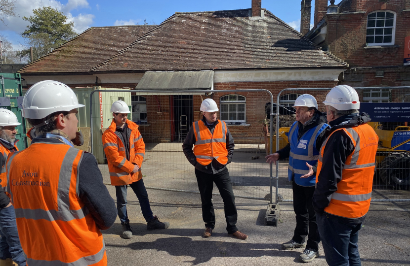 Pictured; Mark Miller (blue jacket) briefs Steve Brine MP at the works site joined by representatives from SWR and the contractors.