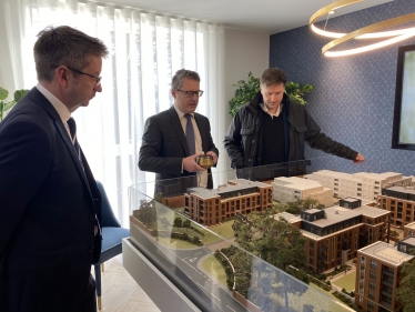 Steve Brine MP with Mark Washer overlooking model of houses